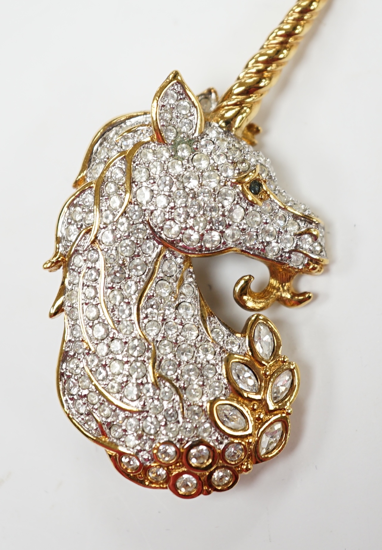 A Swarovski crystal unicorn brooch, 58mm, with Swarovski box. Condition - fair